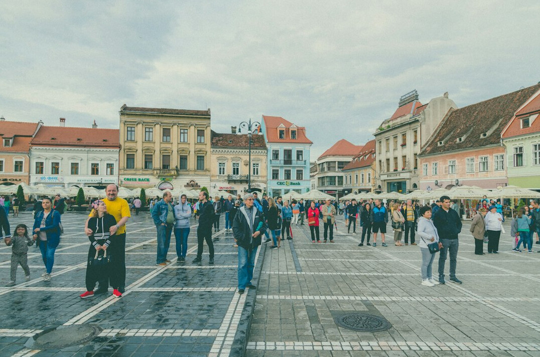 people chatting in city square