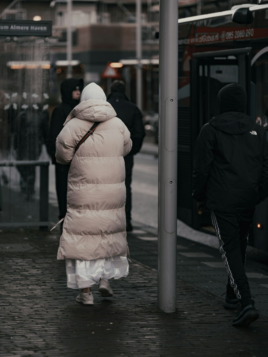 people waiting at bus stop