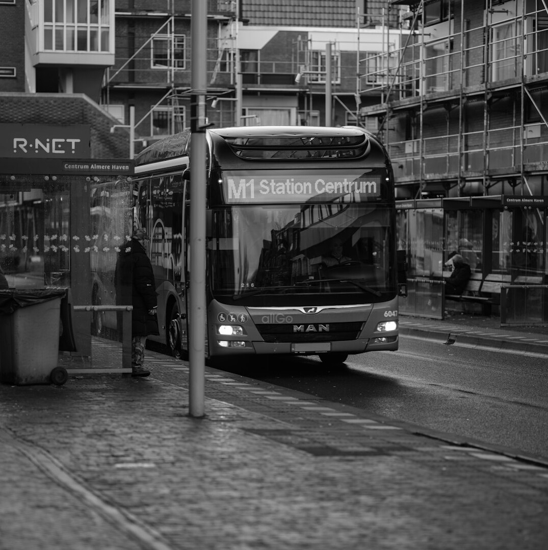 people waiting at bus stop
